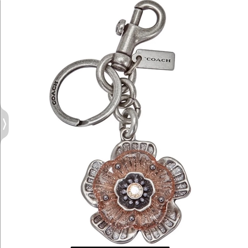 SOLD. NWT Coach Tea Rose bag charm / key chain. Metal and Resin mix.